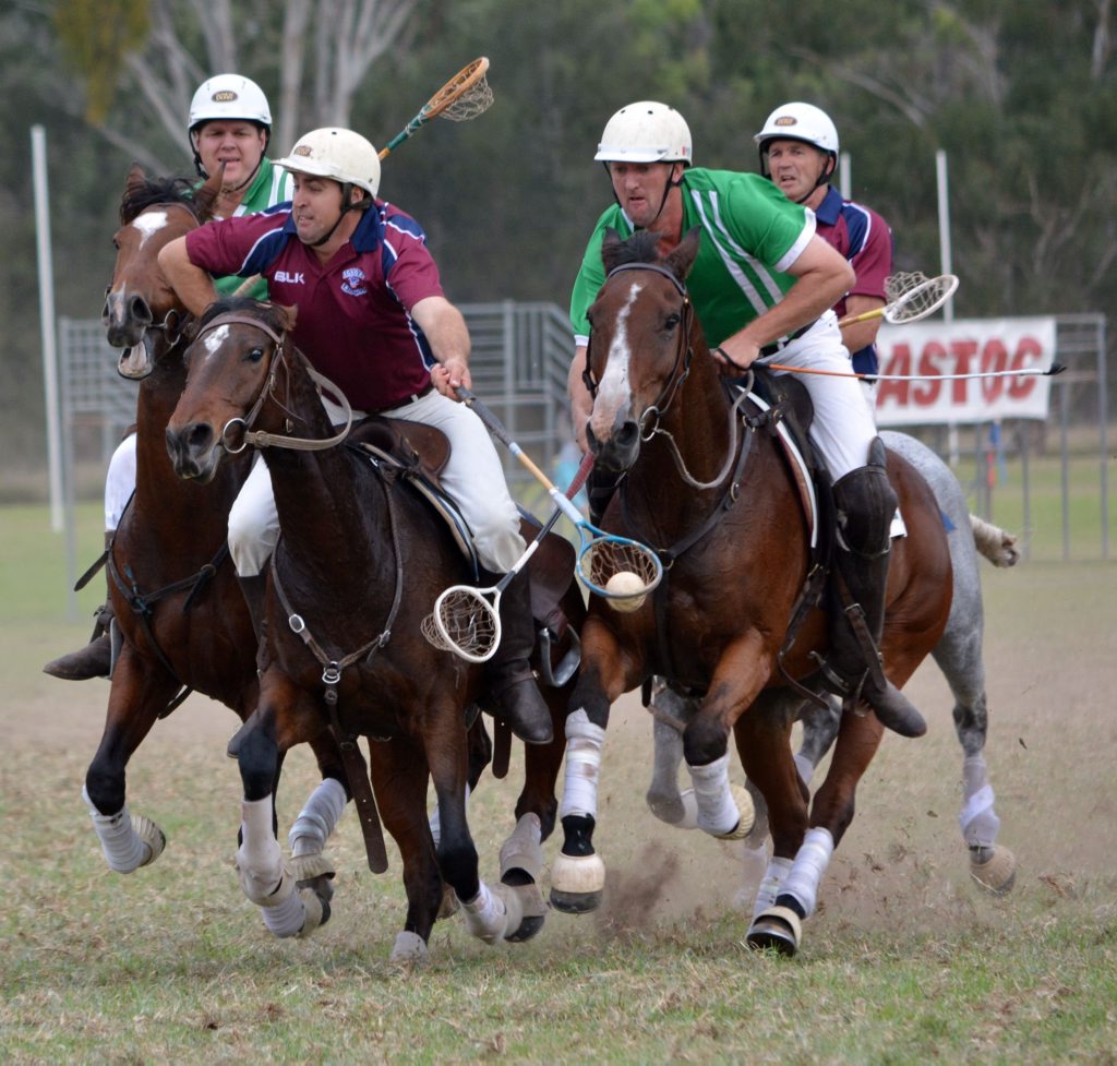 Nathan Jones carrying the ball from Tansey and Kris Lynas trying to dislodge the ball for Warwick.
